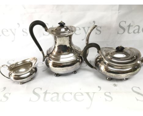 A three piece silver Sheffield hallmarked tea set. 1440g