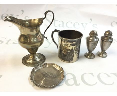 A collection of silver hallmarked items including a dish, S/P shakers, Mug and jug . Postage category B
