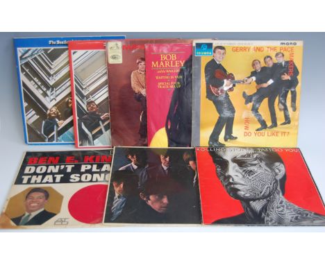 Thirteen various 1960s and later LP vinyl records, to include; The Beatles Red & Blue albums, Rolling Stones Tattoo You, Clif