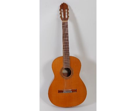 A Joan Cashimira classical Spanish guitar, model 56e, with burbinga wood sides and back; together with associated carry case,