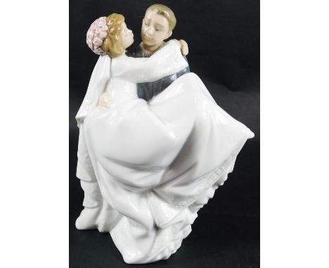 A Nao bride and groom figure group, 20cm high. 