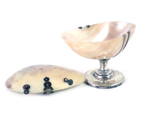 A George V mother of pearl shell salt, mounted in silver, Chester 1923, and a brass and mother of pearl shell trinket box. (2