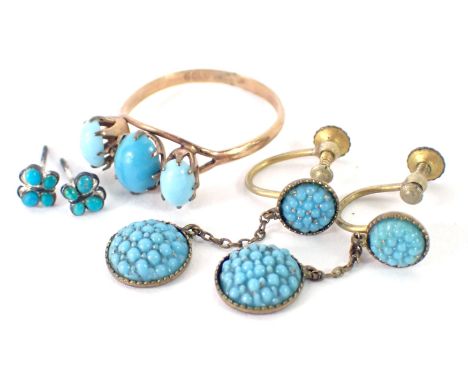 A turquoise jewellery suite, comprising a pair of drop earrings, stud earrings, and a three stone dress ring, each set in rol