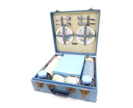 A Brexton picnic hamper, in blue with later Tupperware flask and mugs. 