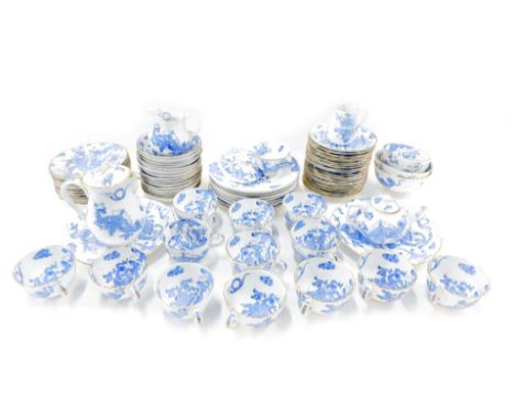 A Royal Worcester blue and white dragon pattern part service, comprising fourteen teacups, eleven saucers, two milk jugs, gra