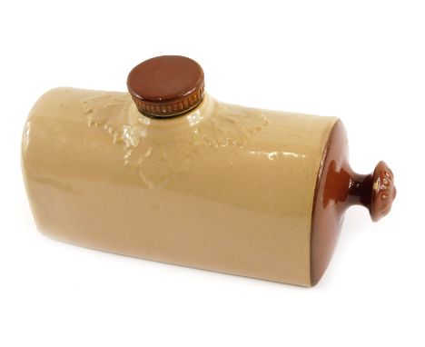 A stoneware hot water bottle, on a light and dark brown ground, 26cm wide. 