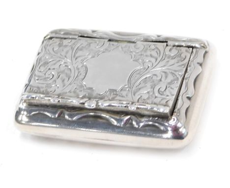 An Edward VII silver rectangular trinket box, with vacant cartouche and scroll decoration, maker ECP, Birmingham 1909, 1oz. 