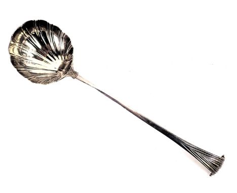 An 18thC silver serving ladle, with Onslow handle and a shell bowl, hallmarks worn, London assay, with rear initials TIB, 6oz