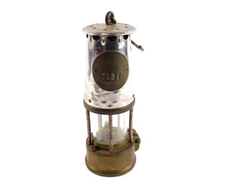 A Protector Lamp and Lighting Company Eccles miner's lamp, in stainless steel and brass, numbered 3531, with carry handle, 24
