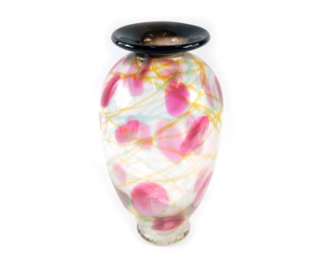 An Adam Aaronson Tin Mill Studio of London Art Glass vase, of blown internal design with yellow swirls and pink dots, on a bl