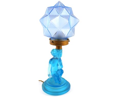 An Art Deco style frosted blue glass table lamp, of figure holding vase of flowers, on triple stepped foot, 26cm high, and a 