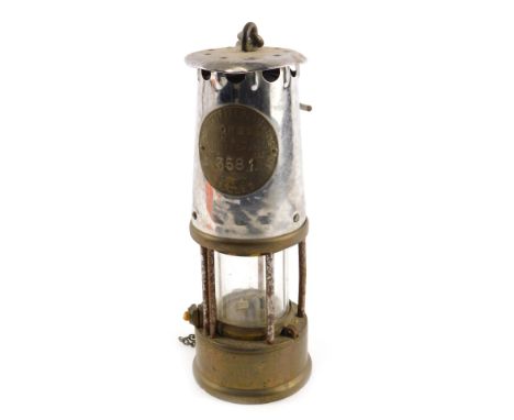 A Protector Lamp and Lighting Company Eccles miner's lamp, in stainless steel and brass, numbered 3581, with carry handle, 24
