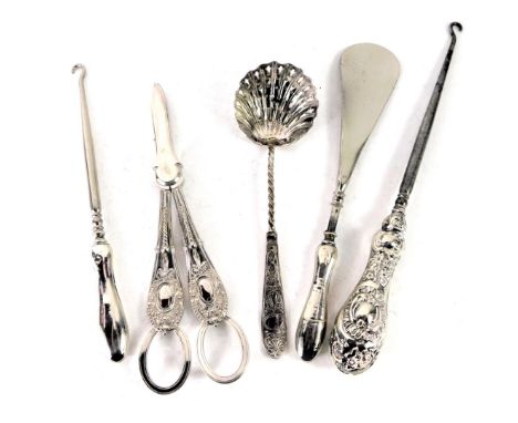 A Continental white metal ladle with a shell bowl, with pierced decoration, white metal unmarked, 0.88oz, two silver handled 