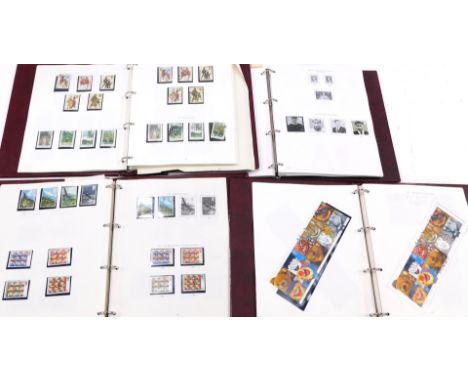 Philately. Four Stanley Gibbons albums of Great Britain collections, 1970s, 1980s, 1990s, and millennium. 