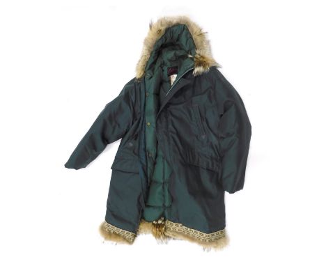 A Carlton of Canada ladies green overcoat, with fur collar and trim. 