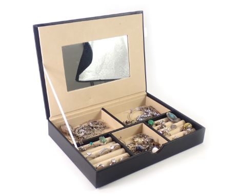 A black leatherette jewellery box and contents, comprising white metal dress rings, a white metal and marcasite bar brooch, b