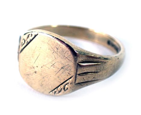 A 9ct gold signet ring, with rectangular panel, with scroll borders and hammered shoulders, ring size T, 5.7g. 