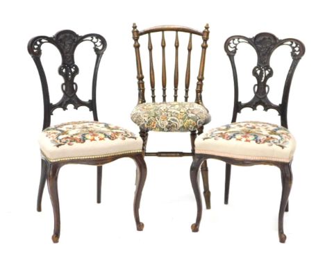 A pair of late Victorian mahogany salon chairs, with cabriole legs, tapestry upholstery, and an ibex kitchen chair. (3)
