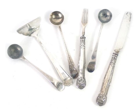 A group of silver and white metal cutlery, comprising a silver fiddle pattern tea spoon, three silver fiddle pattern and engi