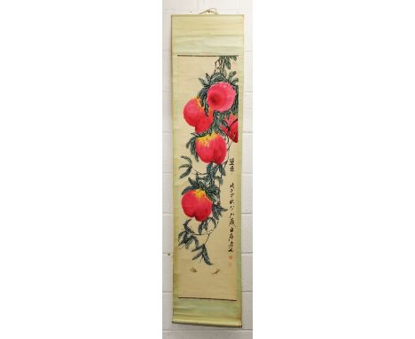 A CHINESE HANGING SCROLL PICTURE ON PAPER, depicting hanging peach, the picture itself 52.75in x 13.25in.