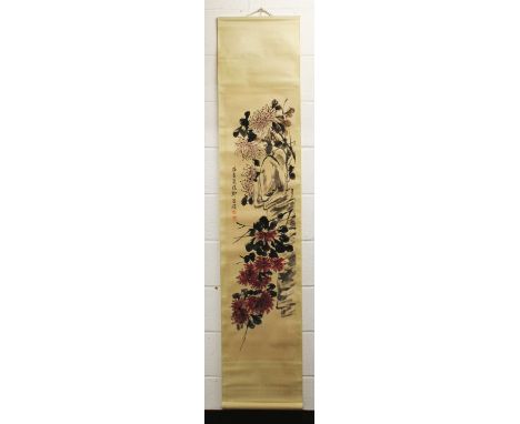 ANOTHER CHINESE HANGING SCROLL PICTURE ON PAPER, decorated with foliage and rockwork, the picture itself 52.75in x 13.3in.