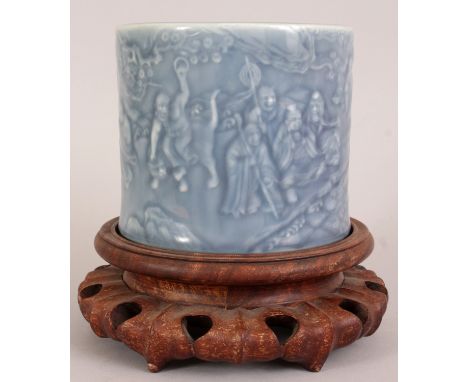 A GOOD QUALITY CHINESE CLAIRE-DE-LUNE MOULDED PORCELAIN BRUSHPOT, together with a fitted wood stand, the sides decorated and 