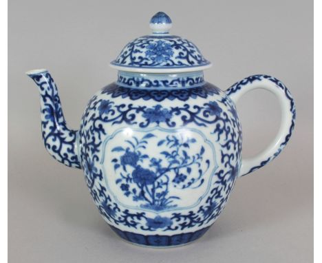 A CHINESE BLUE & WHITE PORCELAIN TEAPOT & COVER, the sides decorated with barbed panels of flowers reserved on a formal folia