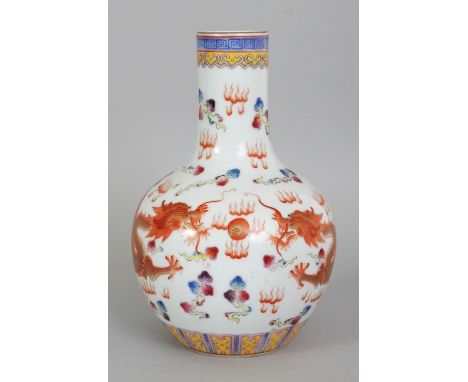 A CHINESE FAMILLE ROSE PORCELAIN DRAGON BOTTLE VASE, decorated with two iron-red and gilt dragons disputing a flaming pearl, 