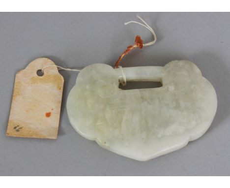 A 19TH/20TH CENTURY CHINESE RUYI FORM JADE PENDANT, with incised characters, 2.25in wide & 1.6in high.