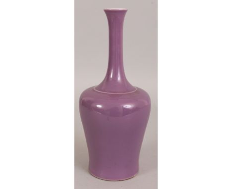 A CHINESE MONOCHROME PORCELAIN VASE, applied with an unusual purple-lilac glaze, the base with a six-character Kangxi mark, 1