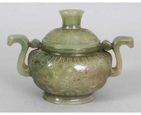 A CHINESE CELADON GREEN JADE LIKE CENSER & COVER, of archaic form with scroll handles, the sides decorated in relief with for
