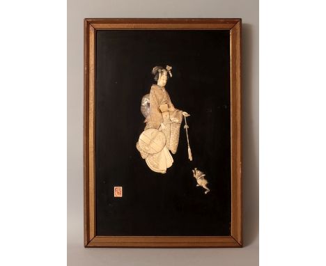 A FRAMED JAPANESE MEIJI PERIOD IVORY & MOTHER-OF-PEARL ONLAID LACQUERED WOOD PLAQUE, decorated with a bijin playing with a ca