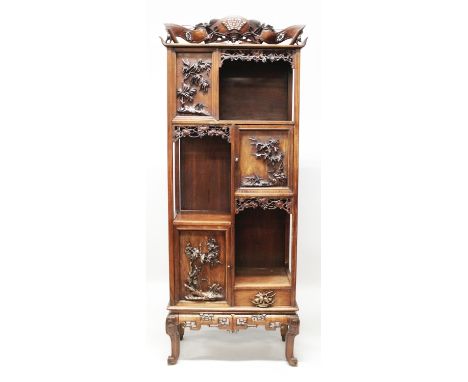 A 19TH/20TH CENTURY CHINESE TALL HARDWOOD DISPLAY CABINET, the doors and panels carved in high relief with bamboo, blossom an