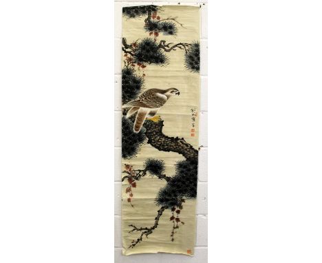 A CHINESE SCROLL PAINTING OF A HAWK PERCHED ON A PINE TREE, with calligraphy and artist's seals, approx. 63.75in x 19in.