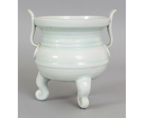 A CHINESE SONG QINGBAI CELADON GLAZED PORCELAIN TRIPOD CENSER, supported on three scroll feet, 5in wide including handles & 5