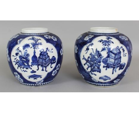 A PAIR OF 19TH CENTURY CHINESE BLUE & WHITE PORCELAIN GINGER JARS, each painted with quatrefoil panels of objects reserved on
