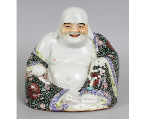 A CHINESE FAMILLE ROSE-VERTE PORCELAIN MODEL OF A SEATED BUDDHA, his elaborate robes with Shou symbols, the base unglazed and