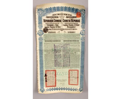 A CHINESE REPUBLIC GOVERNMENT LUNG-TSING-U-HAI 20 pounds sterling RAILWAY BOND, with attached coupons, the bond itself 19.9in