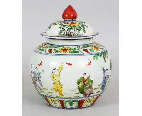 A CHINESE DOUCAI PORCELAIN JAR & COVER, the sides decorated with a continuous scene of boys playing in a garden, the base wit