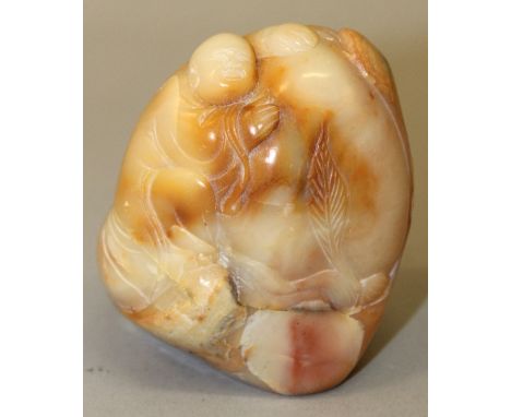 AN UNUSUAL CHINESE JADE GOURD FORM BRUSHWASHER, the interior decorated in high relief with a monkey, the sides with a smaller