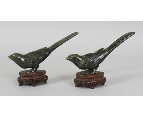 A PAIR OF EARLY 20TH CENTURY CHINESE SPINACH GREEN JADE MODELS OF GOLDEN PHEASANTS, together with a fitted box and fitted woo