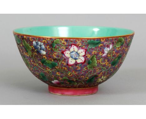 A GOOD QUALITY CHINESE FAMILLE ROSE PORCELAIN BOWL, decorated to the exterior sides with dense scrolling foliage reserved on 