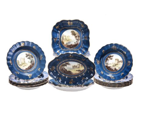 A Royal Worcester powder-blue ground part dessert service signed by C. Johnson, circa 1912, painted with Welsh castle and lan