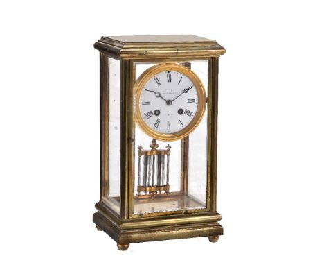 A brass and glazed four-glass mantel clock, the circular French eight-day bell striking movement stamped B.R 83781 and 5 8 to
