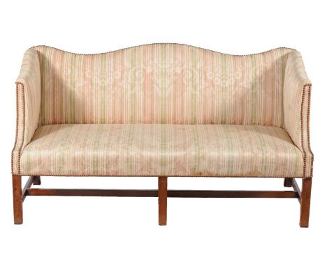 A mahogany and upholstered sofa in George III style, late 18th century and later, with serpentine back, 80cm high, 147cm wide