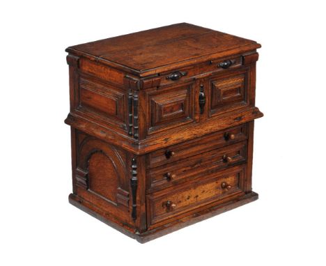 A Charles II oak commode, circa 1680, with three drawers to the lower section, 58cm high, 55cm wide, 40cm deep
