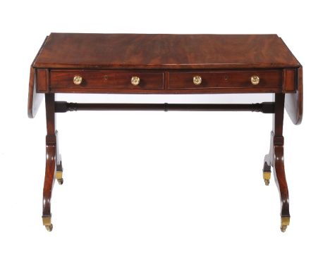 A Regency mahogany sofa table, circa 1815, attributed to Gillows, the drop ends with rounded corners above two frieze drawers