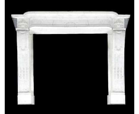 A carved variegated white marble chimneypiece in Louis XVI style, 20th century, with breakfront shelf above a plain frieze ru