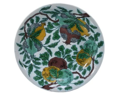 A Chinese Famille Verte dish, in Kangxi style, the interior decorated with quinces and pomegranates borne on leafy branches p