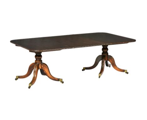 A mahogany twin pillar dining table in George III style, late 19th century, with one additional leaf insertion, 71cm high, 21